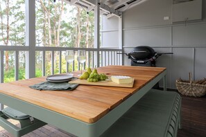 Outdoor setting with BBQ for guest use 