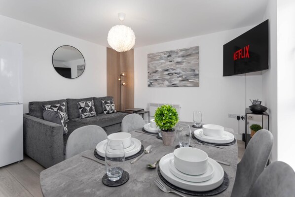 Comfortable Open-Plan Living Space featuring:

- Smart TV with Netflix
- 1 x Large Sofa Beds
- Dining Area