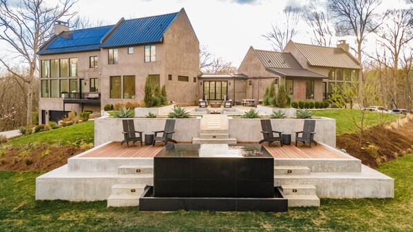 Cheers as you relax at the firepit or in the spool!