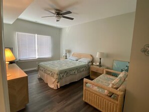 Master Suite equipped with Queen size bed, mini sofa and table for work space 
