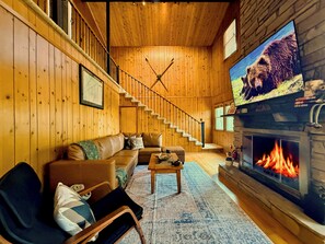 Cozy wood burning fireplace and new furniture to gather on