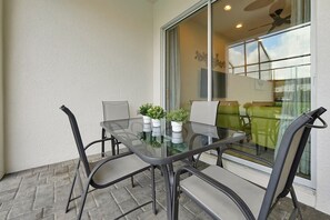 Delight in outdoor living with our patio and pool setup, featuring plush furniture, a sparkling pool, and a tranquil space for enjoying sunny days and warm evenings.