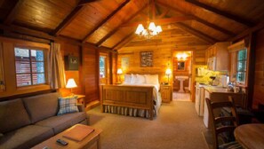 A warm and inviting cabin interior, where rustic wood finishes and soft lighting create the perfect mountain retreat.