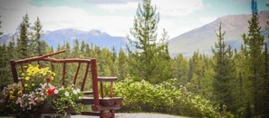 Surrounded by breathtaking mountain views, the outdoor seating area is an ideal spot to soak in the fresh alpine air and the tranquility of nature.