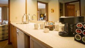 A well-appointed kitchenette offers convenience and comfort, perfect for a relaxing morning coffee or a quiet evening in.