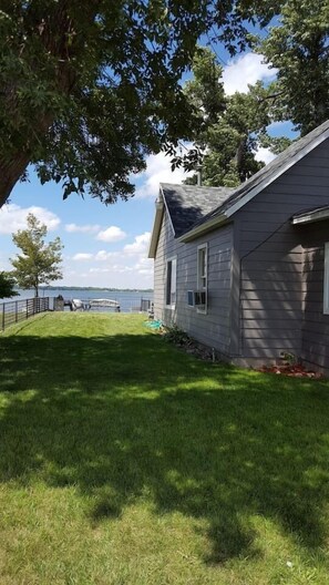 side yard perfect for bean bags or spike ball