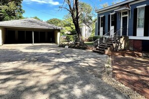 The back entry way has a patio with available outdoor chairs and a fire pit. There is also a two car garage.

This is will be your common point of access.