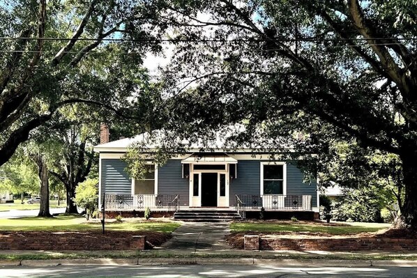 The front entryway showcases a copper overhang and tiled front porch.