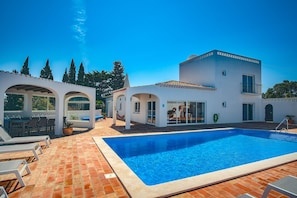 Pool with sun terrace and shaded covered area