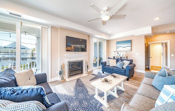 Comfy open living room area with plush seating and fireplace