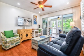 Gather with family and friends for a cozy movie night, sinking into the comfortable living room seating after a day of island adventures.