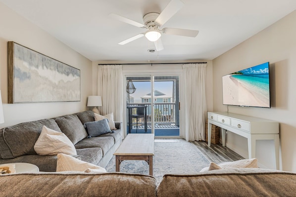 Cozy living room with a comfortable couch, flat-screen TV, and relaxing views—perfect for unwinding.