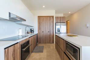 Fully equipped kitchen with modern appliances, ample counter space, and plenty of storage. Designed for both convenience and style, it's perfect for preparing anything from a quick snack to a full meal.