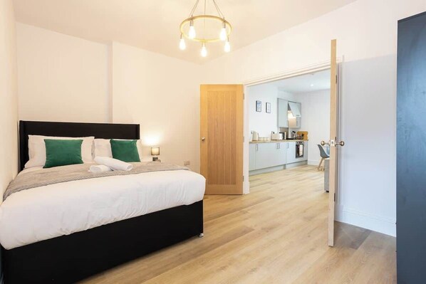 The bedroom benefits from a luxury en-suite bathroom, a king-size bed and plenty of storage.