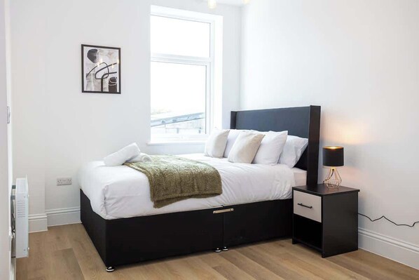 The bedroom benefits from a luxury en-suite bathroom, a king-size bed and plenty of storage.