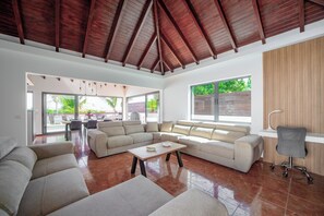 Air-conditoned  living room with HD-TV, DVD player, Dish Network satellite, iPod dock, ceiling fan. 