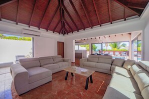 Air-conditoned  living room with HD-TV, DVD player, Dish Network satellite, iPod dock, ceiling fan. 
