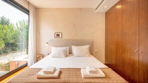 A restful space with garden views and soft, neutral tones for a peaceful night’s sleep. #Comfort #RelaxingStay #portugal #pt #troia