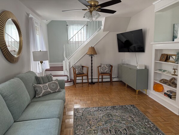 Living Room with 2 Pop Up Queen Beds