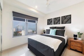 Wake to soft ocean glimpses after a restful night on the king bed in the primary bedroom.