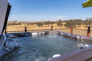Relax in the large hot tub under the stars