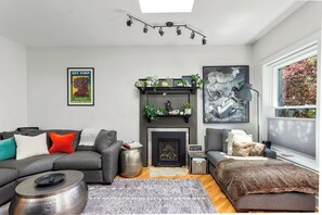 Snuggle into the plush sectional or chaise  lounge next to the fireplace.