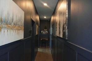 Hallway from main stairwell towards both living rooms