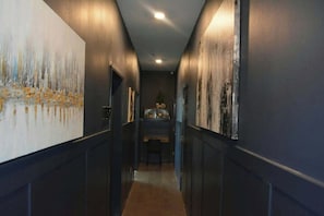Hallway from main stairwell towards both living rooms