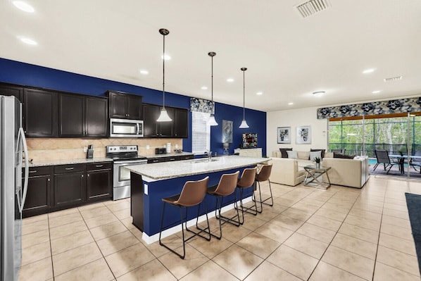 Pull up a seat! The kitchen island with barstools is the perfect spot for morning coffee or evening cocktails.