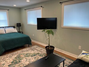 The wall mounted TV can be angle toward the living room area or toward the bed.
