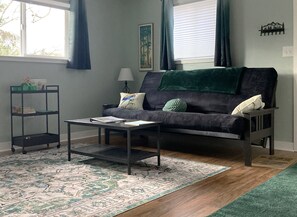 Futon couch makes into a queen bed.