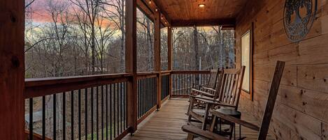 4 Rocking Chairs with 2 side tables, recess lighting and string lights.