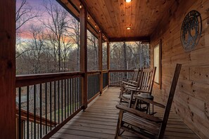 4 Rocking Chairs with 2 side tables, recess lighting and string lights. 