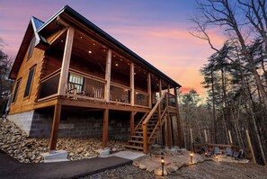 Illuminated walkway with pavers leading to the Fire Pit. Private parking.