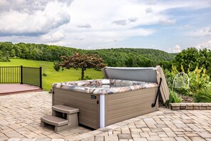 Enjoy the expansive mountain and valley views while slipping into the hot tub waters.