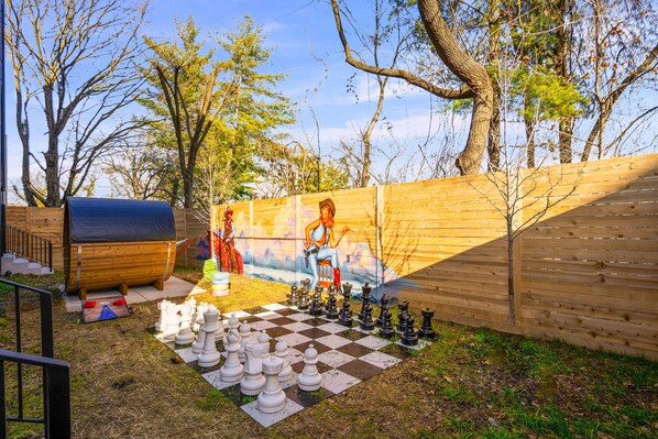 Step into your private oasis in Nashville! Enjoy giant chess amid vibrant murals and greenery—a perfect spot for groups or family reunions. Relax in this stylish outdoor retreat after a day in Music City!