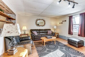 Living Room | Smart TV w/ Cable | Window A/C Unit | Radiator Heating