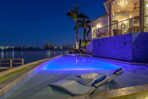 A nighttime oasis—dip into relaxation under the soft glow of the lights.