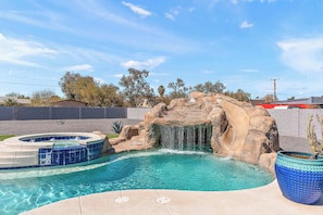 Make a Splash! Dive into fun with the rock waterfall and waterslide! 
