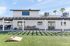 Enjoy some friendly competition with a game of cornhole in the outdoor entertainment space.