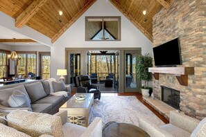 Spacious open-floor living room with seamless access to the screened-in porch—perfect for indoor-outdoor relaxation!