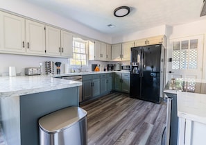 "Open concept kitchen and living space, perfect for gatherings."