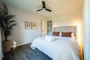 "Relaxing bedroom with bedside lamps."