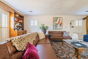 "Cozy up in our stylish living room."

