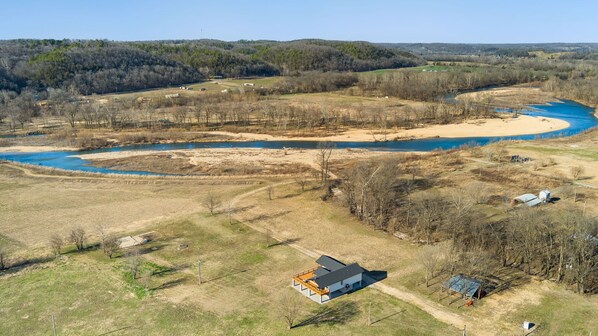 Elk View is a gorgeous, secluded riverside home nestled in 17 private acres with 600 feet of shoreline and direct access to The Elk River.