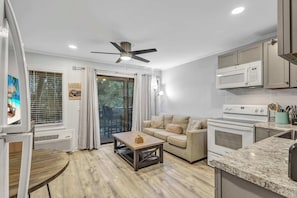 Bright and inviting, this living space is perfect for unwinding after a day at the beach.