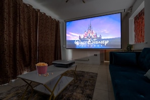 Living room - 50' Smart TV loaded with Netflix, HDMI cable, Projector, ambient lighting, extra fast wifi & a Pool table - Complimentary tea & coffee available for your enjoyment