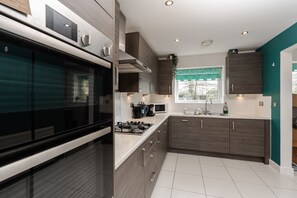Kitchen/diner. Fully equipped with cooking equipment perfect for families. Appliances such as washer, fridge freezer, microwave, oven are free and available for your use. - Pool table available for relaxation