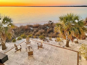 Relax on the lower patio with four adirondack chairs