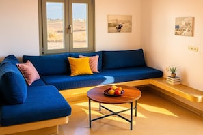 Second View of the Interior Living Area
Ample sunlight, soft tones, and practical decor for a homey feel.